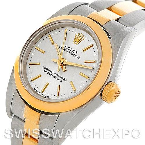 The image shows a Rolex Oyster Perpetual 76183 Women's Steel and Gold (two tone) Silver Dial 76183 Women's Steel and Gold (two tone) Silver Dial watch from an angled top-down perspective, highlighting the dial, bezel, crown, and bracelet.