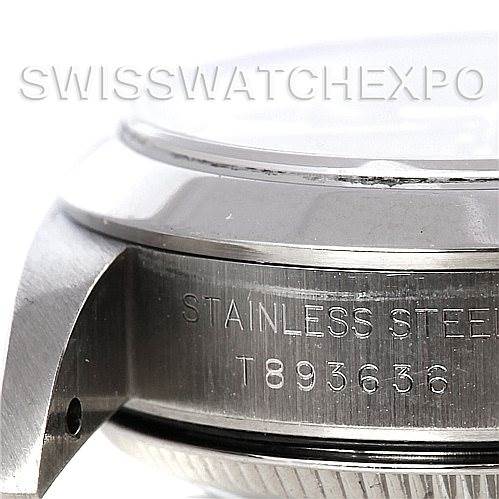 This image shows a close-up of the side of a Rolex Oyster Perpetual 67180 Women's Stainless Steel Blue Dial 67180 Women's Stainless Steel Blue Dial watch case, highlighting the stainless steel engraving and part of the bezel.