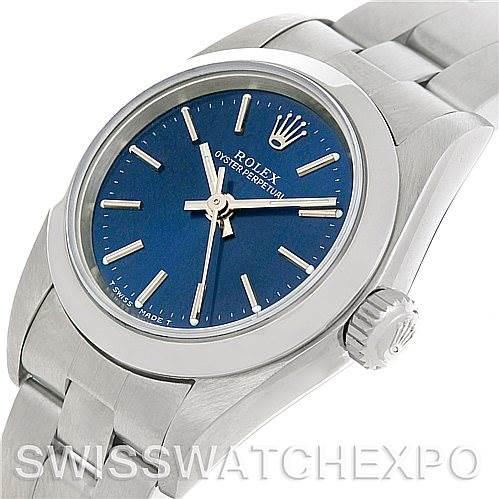 The image shows a Rolex Oyster Perpetual 67180 Women's Stainless Steel Blue Dial 67180 Women's Stainless Steel Blue Dial watch angled slightly from above, featuring the face, bezel, crown, and part of the bracelet.