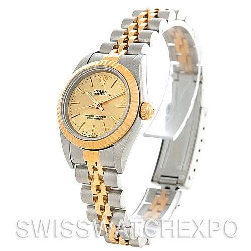 This Rolex Oyster Perpetual 76193 Women's Steel and Gold (two tone) Champagne Dial 76193 Women's Steel and Gold (two tone) Champagne Dial watch is shown at a slight left-side angle, highlighting the dial, bezel, and bracelet.