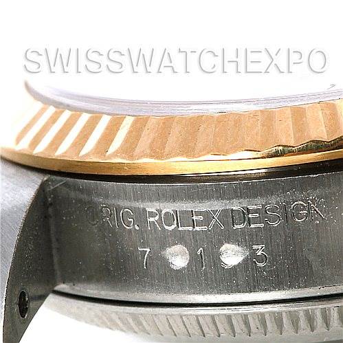Close-up of the side of a Rolex Oyster Perpetual 76193 Women's Steel and Gold (two tone) Champagne Dial 76193 Women's Steel and Gold (two tone) Champagne Dial watch, focusing on the design marking and serial number.