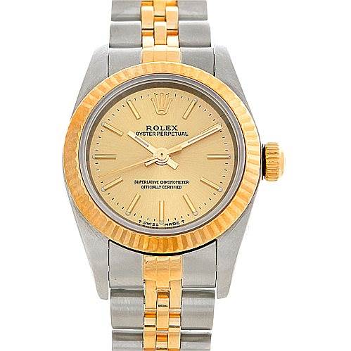 This image shows a front view of a Rolex Oyster Perpetual 76193 Women's Steel and Gold (two tone) Champagne Dial 76193 Women's Steel and Gold (two tone) Champagne Dial watch, featuring a two-tone bracelet and gold bezel.