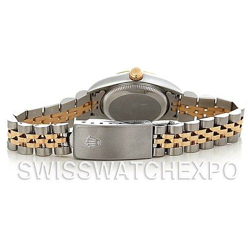 The image shows the rear view of a Rolex Oyster Perpetual 76193 Women's Steel and Gold (two tone) Champagne Dial 76193 Women's Steel and Gold (two tone) Champagne Dial watch, focusing on the back of the case and the two-tone bracelet with a clasp.