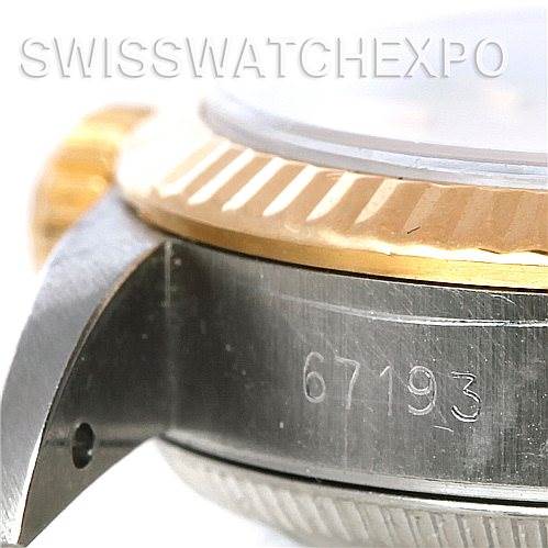 This close-up angle of the Rolex Oyster Perpetual 67193 Women
s Steel and Gold (two tone) Silver Dial 67193 Women
s Steel and Gold (two tone) Silver Dial watch shows the side of the case, part of the bezel, and the serial number 67193.