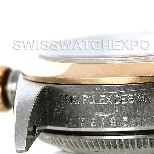 The image shows a close-up view of the side of a Rolex Oyster Perpetual 76183 Women's Steel and Gold (two tone) White Dial 76183 Women's Steel and Gold (two tone) White Dial watch case, displaying the bezel, lugs, and part of the engraved design information.