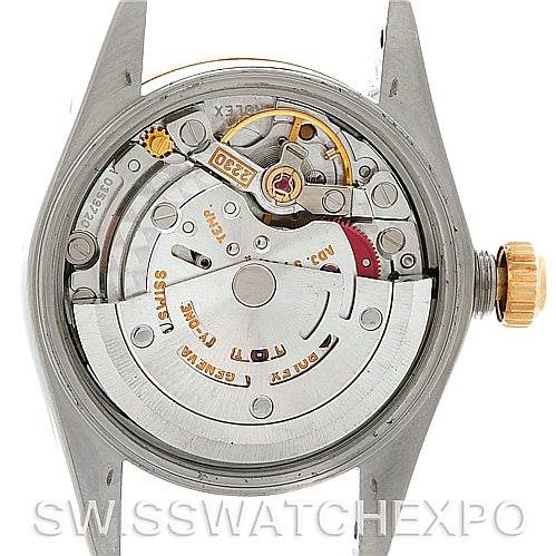 The image shows the internal mechanism of a Rolex Oyster Perpetual 76183 Women's Steel and Gold (two tone) White Dial 76183 Women's Steel and Gold (two tone) White Dial watch from a back angle.