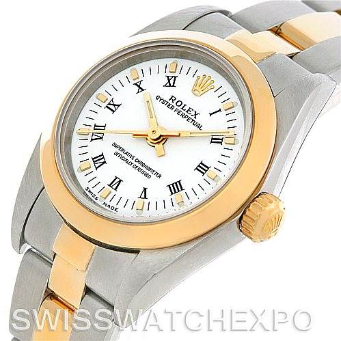 This image shows a close-up of the face, bezel, crown, and part of the bracelet of a Rolex Oyster Perpetual 76183 Women's Steel and Gold (two tone) White Dial 76183 Women's Steel and Gold (two tone) White Dial watch.