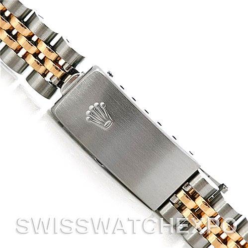 This image shows a close-up of the clasp and bracelet of a Rolex Oyster Perpetual 76193 Women's Steel and Gold (two tone) Black Dial 76193 Women's Steel and Gold (two tone) Black Dial watch.