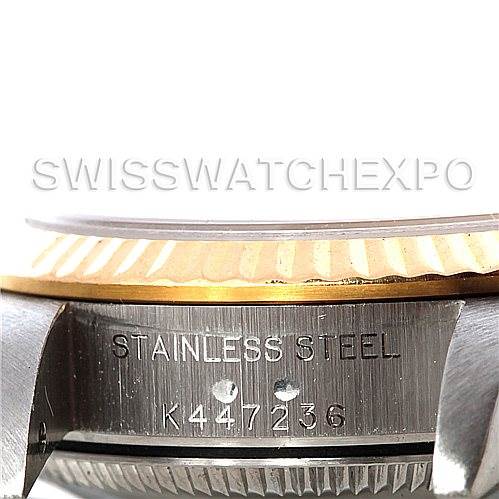 The image shows a close-up of the side and part of the bezel of a Rolex Oyster Perpetual 76193 Women's Steel and Gold (two tone) Black Dial 76193 Women's Steel and Gold (two tone) Black Dial watch in stainless steel.
