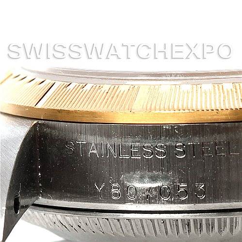 The image shows a close-up of the case side of a Rolex Oyster Perpetual 76243 Women's Steel and Gold (two tone) Silver Dial 76243 Women's Steel and Gold (two tone) Silver Dial watch, highlighting the stainless steel material and engraved serial number.