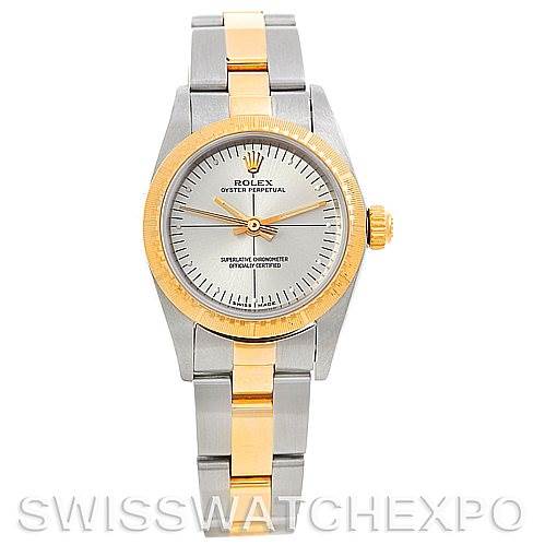 This Rolex Oyster Perpetual 76243 Women's Steel and Gold (two tone) Silver Dial 76243 Women's Steel and Gold (two tone) Silver Dial watch is shown from a straight-on, front view, displaying its face, bezel, crown, and bracelet.