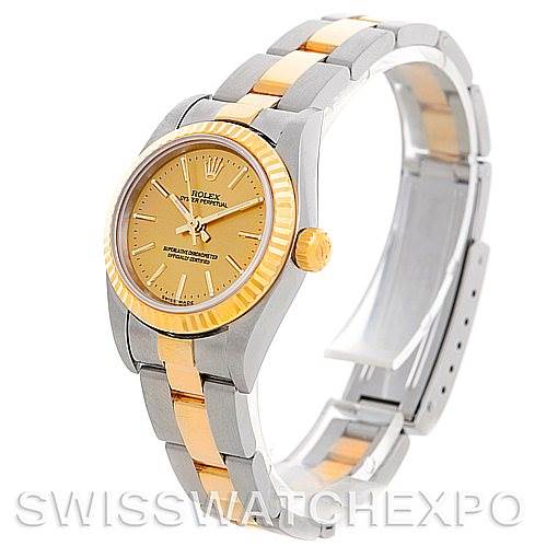 The Rolex Oyster Perpetual 76193 Women's Steel and Gold (two tone) Champagne Dial 76193 Women's Steel and Gold (two tone) Champagne Dial watch is pictured at a slight angle, showing the face, bezel, and part of the bracelet.
