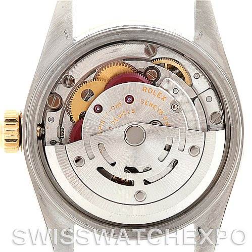This image shows the back view of the Rolex Oyster Perpetual 76193 Women's Steel and Gold (two tone) Champagne Dial 76193 Women's Steel and Gold (two tone) Champagne Dial watch, revealing its internal mechanical movement.