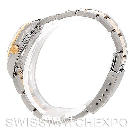 The image shows a side view of a Rolex Oyster Perpetual 76193 Women's Steel and Gold (two tone) Champagne Dial 76193 Women's Steel and Gold (two tone) Champagne Dial watch, focusing on its bracelet, crown, and clasp.