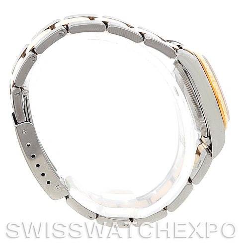 This image shows the side view of a Rolex Oyster Perpetual 76193 Women's Steel and Gold (two tone) Champagne Dial 76193 Women's Steel and Gold (two tone) Champagne Dial watch, highlighting its strap and case thickness.