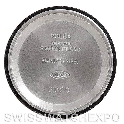 The image shows the inside case back of a Rolex Oyster Perpetual 76094 Women's Stainless Steel White Dial 76094 Women's Stainless Steel White Dial watch, displaying engravings of the brand, origin, material, and year.