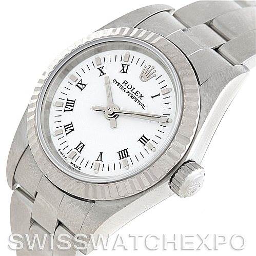 This image shows a top-angled view of the Rolex Oyster Perpetual 76094 Women's Stainless Steel White Dial 76094 Women's Stainless Steel White Dial watch, featuring the dial, bezel, crown, and part of the bracelet.
