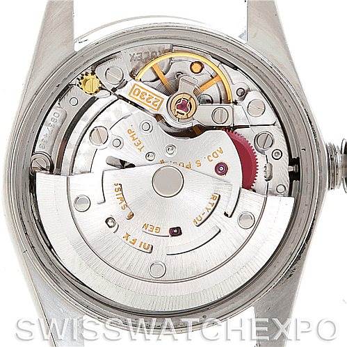 The image shows the internal mechanism of a Rolex Oyster Perpetual 76094 Women's Stainless Steel White Dial 76094 Women's Stainless Steel White Dial watch from a top-down angle with the case back removed.