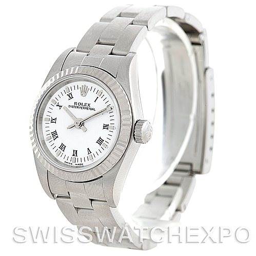 The Rolex Oyster Perpetual 76094 Women's Stainless Steel White Dial 76094 Women's Stainless Steel White Dial watch is shown from a three-quarter angle, showcasing its bracelet, bezel, and crown.