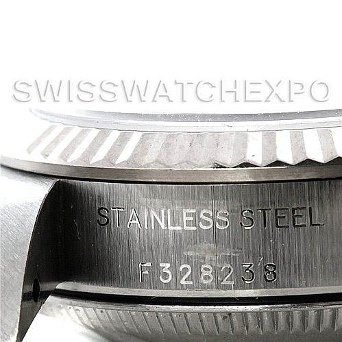 This image shows a close-up of the side of a Rolex Oyster Perpetual 76094 Women's Stainless Steel White Dial 76094 Women's Stainless Steel White Dial's stainless steel case, highlighting the serial number "F328238."