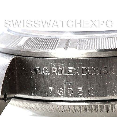 The close-up image shows the side of a Rolex Oyster Perpetual 76030 Women's Stainless Steel Blue Dial 76030 Women's Stainless Steel Blue Dial watch, focusing on the engraved text and serial number 76030.