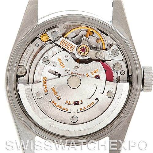 The image shows the back view of the Rolex Oyster Perpetual 76030 Women's Stainless Steel Blue Dial 76030 Women's Stainless Steel Blue Dial watch, highlighting its intricate automatic movement and internal components.