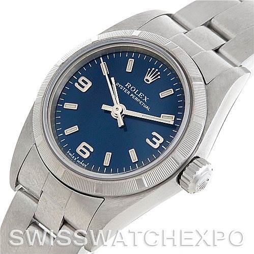 This image shows a Rolex Oyster Perpetual 76030 Women's Stainless Steel Blue Dial 76030 Women's Stainless Steel Blue Dial watch at an angled top-down view, highlighting its blue dial, bezel, case, and part of the bracelet.