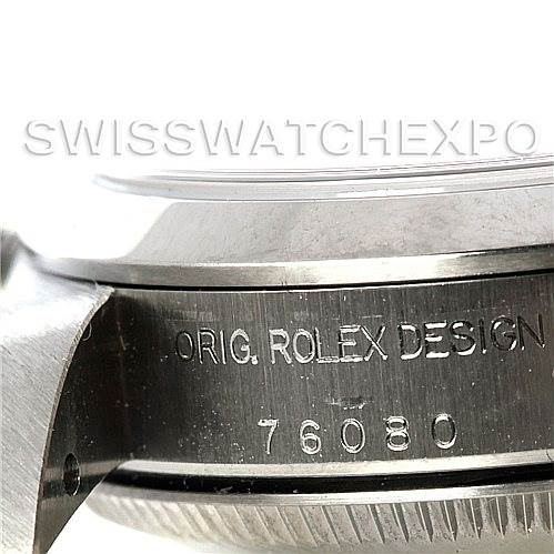 This close-up angle shows the engraved side of the case of an Oyster Perpetual model by Rolex, highlighting the serial number.