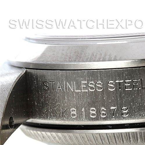 This close-up photo of the Rolex Oyster Perpetual 76080 Women's Stainless Steel White Dial 76080 Women's Stainless Steel White Dial shows the engraved stainless steel case from a side angle.