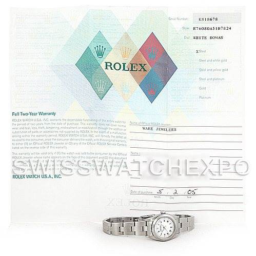 The image shows a Rolex Oyster Perpetual 76080 Women's Stainless Steel White Dial 76080 Women's Stainless Steel White Dial model watch placed in front of its warranty papers, viewed from a front angle.