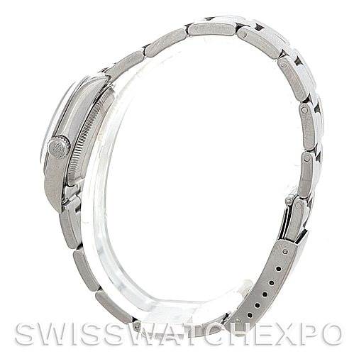 The image shows a side profile of a Rolex Oyster Perpetual 76080 Women's Stainless Steel White Dial 76080 Women's Stainless Steel White Dial watch, highlighting the case, crown, and metal bracelet.