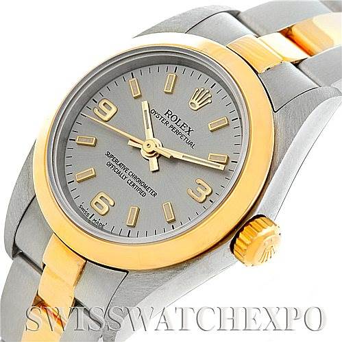 This image displays a Rolex Oyster Perpetual 76183 Women's Steel and Gold (two tone) Grey Dial 76183 Women's Steel and Gold (two tone) Grey Dial watch at an angle showcasing the dial, bezel, crown, and part of the bracelet.