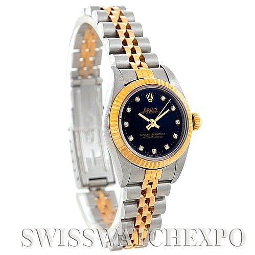 This image shows a side view of a Rolex Oyster Perpetual 76193 Women's Steel and Gold (two tone) Black Dial 76193 Women's Steel and Gold (two tone) Black Dial watch with a two-tone bracelet, black dial, and diamond hour markers.