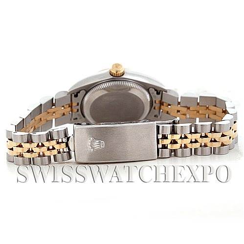 The image shows the back and clasp of a Rolex Oyster Perpetual 76193 Women's Steel and Gold (two tone) Black Dial 76193 Women's Steel and Gold (two tone) Black Dial watch, emphasizing its two-tone metal bracelet.