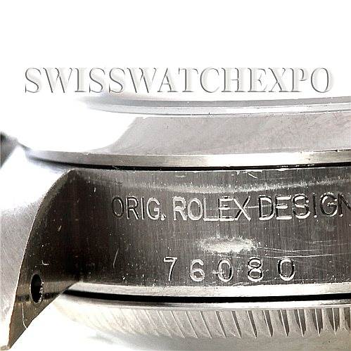 The image shows a close-up of the side profile of a Rolex Oyster Perpetual 76080 Women's Stainless Steel Pink Dial 76080 Women's Stainless Steel Pink Dial watch, focusing on the engraved case with the inscription "Orig. Rolex Design 76080."