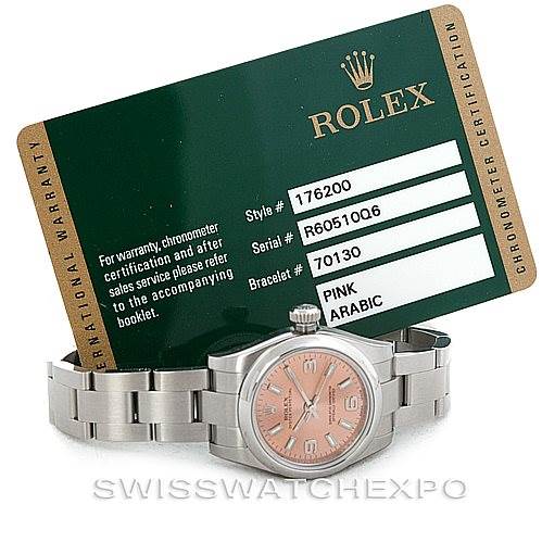This image shows a Rolex Oyster Perpetual 176200 Women's Stainless Steel Pink Dial 176200 Women's Stainless Steel Pink Dial watch with a pink Arabic numeral dial and a stainless steel bracelet, accompanied by its warranty card.