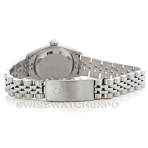 The image shows the back view of the Rolex Oyster Perpetual 67180 Women's Stainless Steel Silver Dial 67180 Women's Stainless Steel Silver Dial watch, focusing on the case back and the bracelet clasp.