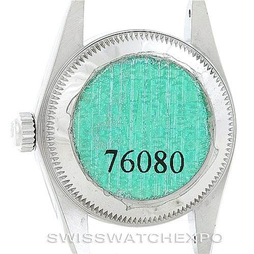 The image shows the case back and winding crown of a Rolex Oyster Perpetual 76080 Women's Stainless Steel Black Dial 76080 Women's Stainless Steel Black Dial watch viewed from the back.