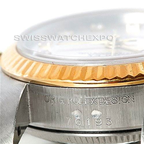 The image shows a close-up side view of a Rolex Oyster Perpetual 76193 Women's Steel and Gold (two tone) Silver Dial 76193 Women's Steel and Gold (two tone) Silver Dial watch, focusing on the case and bezel.