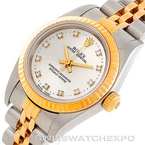 The image shows a Rolex Oyster Perpetual 76193 Women's Steel and Gold (two tone) Silver Dial 76193 Women's Steel and Gold (two tone) Silver Dial watch at an angled view, highlighting the face, bezel, lugs, crown, and part of the bracelet.