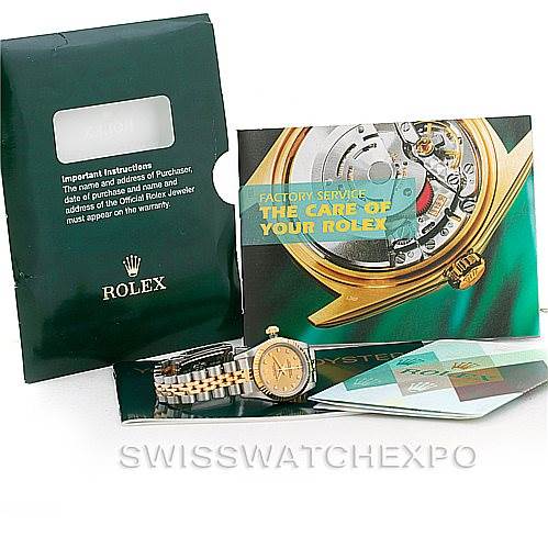 The image shows an Oyster Perpetual Rolex watch, green certificate holder, warranty card, and care booklet.