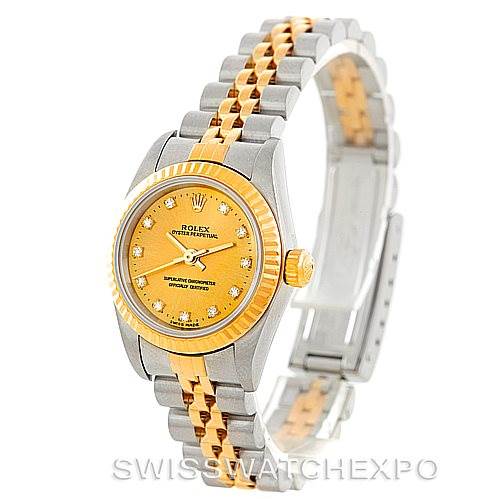The image shows a side view of a Rolex Oyster Perpetual 76193 Women's Steel and Gold (two tone) Champagne Dial 76193 Women's Steel and Gold (two tone) Champagne Dial watch, highlighting its gold and silver bracelet, bezel, and yellow dial.