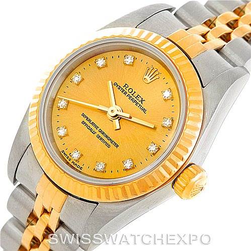 The image shows a close-up view of a Rolex Oyster Perpetual 76193 Women's Steel and Gold (two tone) Champagne Dial 76193 Women's Steel and Gold (two tone) Champagne Dial watch, highlighting the face, bezel, crown, and part of the bracelet.