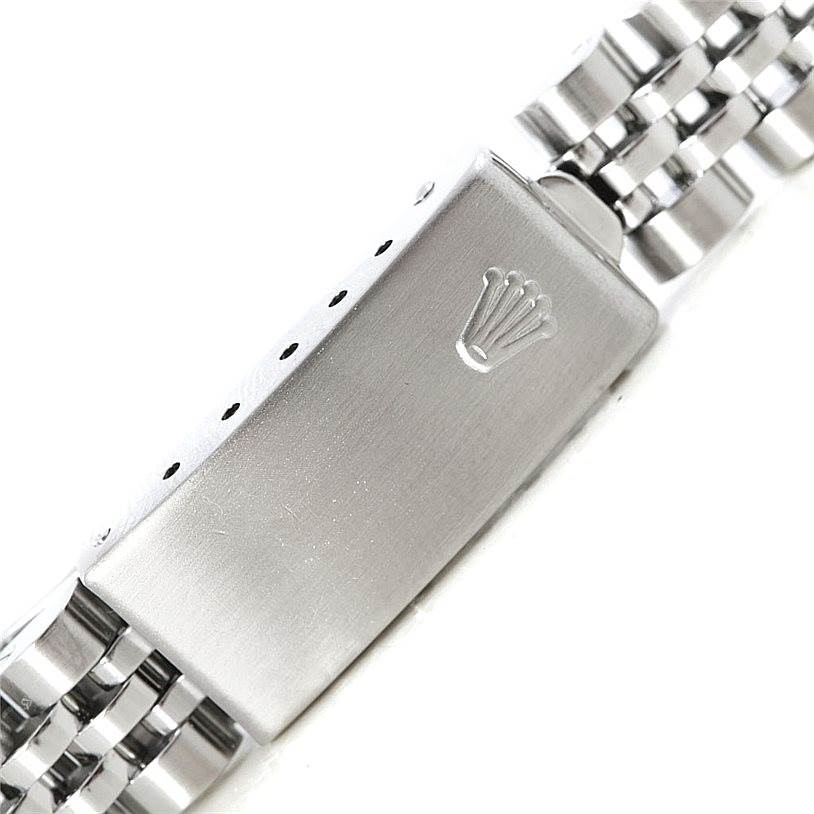 This image shows the clasp and part of the bracelet of a Rolex Oyster Perpetual 76080 Women's Stainless Steel Black Dial 76080 Women's Stainless Steel Black Dial watch.