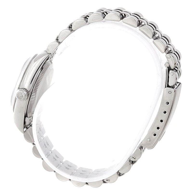 The image shows a side view of the Rolex Oyster Perpetual 76080 Women's Stainless Steel Black Dial 76080 Women's Stainless Steel Black Dial watch, highlighting the bezel, crown, and part of the bracelet.