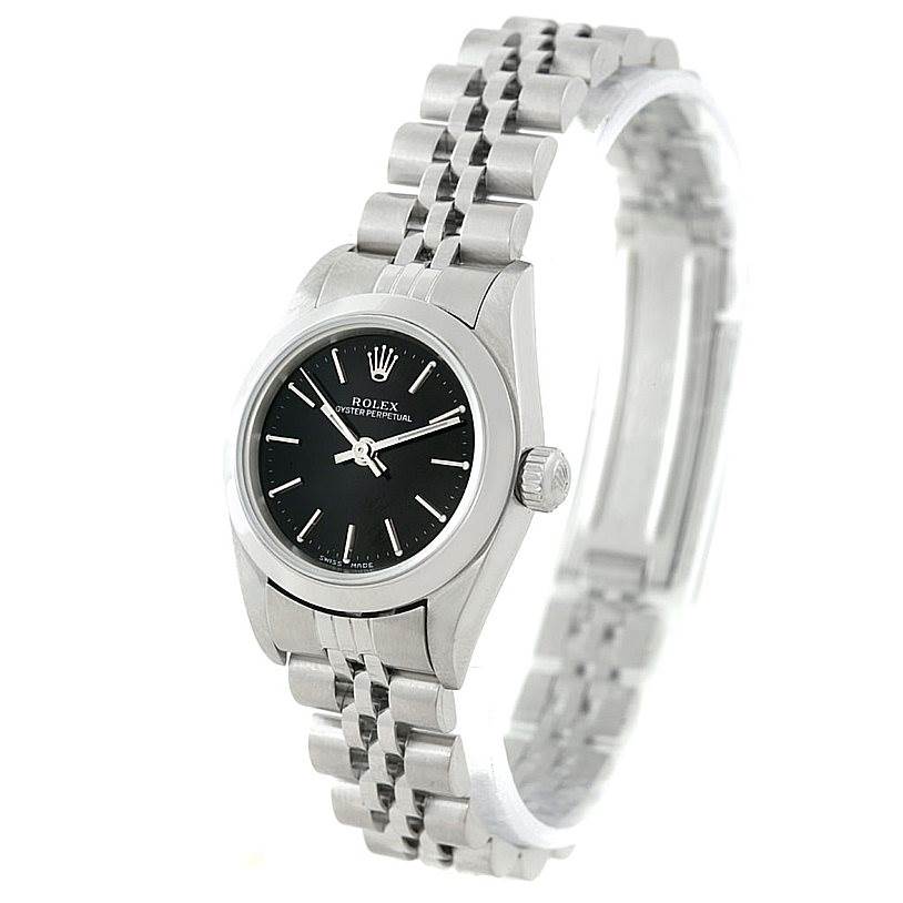 The image shows a Rolex Oyster Perpetual 76080 Women's Stainless Steel Black Dial 76080 Women's Stainless Steel Black Dial watch at a three-quarter angle, highlighting the face, bezel, crown, and bracelet.