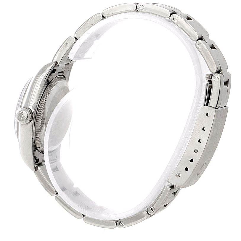 This side view shows the case, crown, and bracelet of the Rolex Oyster Perpetual 76030 Women's Stainless Steel Black Dial 76030 Women's Stainless Steel Black Dial watch.