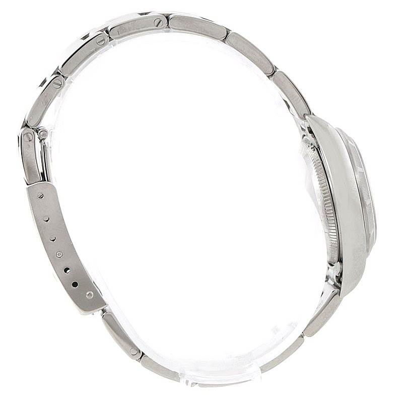 The image shows a Rolex Oyster Perpetual 76030 Women's Stainless Steel Black Dial 76030 Women's Stainless Steel Black Dial watch from a side angle focusing on the band and case.