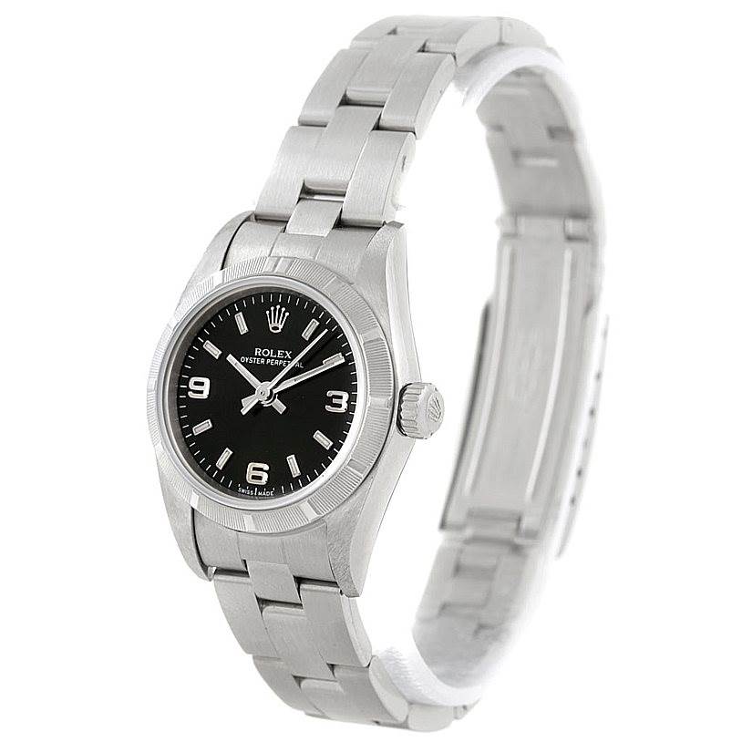 The image shows a side angle of the Rolex Oyster Perpetual 76030 Women's Stainless Steel Black Dial 76030 Women's Stainless Steel Black Dial watch, featuring its stainless steel bracelet, black dial, and crown.