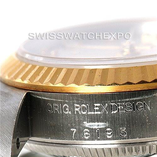 This image shows a close-up of the side case and bezel of a Rolex Oyster Perpetual 76193 Women's Steel and Gold (two tone) Silver Dial 76193 Women's Steel and Gold (two tone) Silver Dial watch, highlighting the model number and engraving.